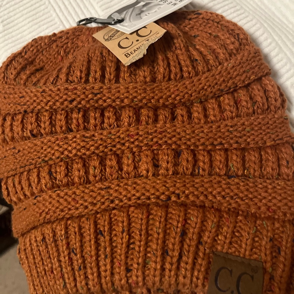 Ladies new with tags beanie by CC.  Burnt orange.